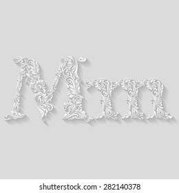 Handsomely decorated letter M in upper and lower case on gray