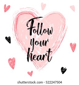 Handwriting calligraphy Follow your heart. Hand drawn brush lettering isolated on white background with heart in pastel pink color palette. St Valentine's day love card template, banner