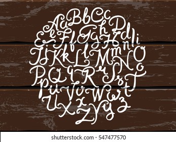 Handwritten alphabet vector font. Hand drawn brush script letters on the old painted wood panels background. Stock vector lettering typography
