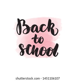 Handwritten brush lettering back to school. Vector calligraphy illustration with pink watercolor stain on background. Textile graphic, t-shirt print.