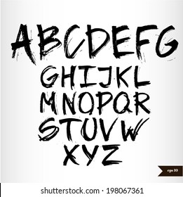 Handwritten calligraphic black watercolor alphabet
