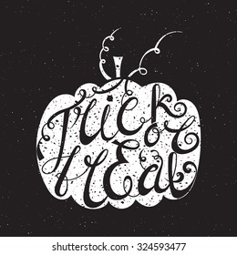 Handwritten calligraphic grunge inscription Trick or treat inscribed in pumpkin. Design element for banner, card, invitation, label, postcard, vignette, label, poster, emblem etc. Vector illustration.