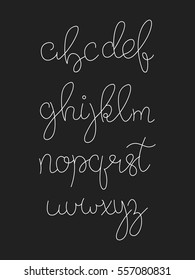 Handwritten calligraphy. Calligraphic font isolated on black. Script typeface