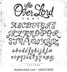 Handwritten calligraphy ¨The Over Lord¨ font, black on the gris textured background