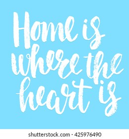 Handwritten "Home is where the heart is" motivation poster with blue background.