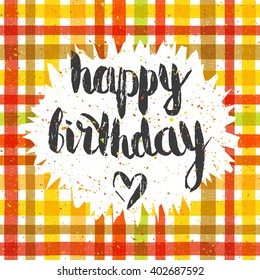 Handwritten inscription Happy birthday on tartan colorful pattern background. Hand drawn lettering for banner, calendar, planner, poster, postcard, greeting card, t-shirt. Vector illustration