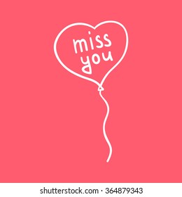 handwritten inscription miss you on a balloon in the shape of a heart