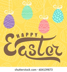 Handwritten lettering happy easter on background yellow easter egg with ornament