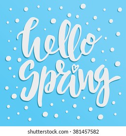 Handwritten lettering "Hello spring". Brush Pen modern calligraphy isolated on blue background with white dots. 