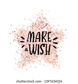 Handwritten lettering phrase: Make a wish, on a pink gold glitter star. It can be used for card, brochures, poster, flyer, t-shirt, promotional materials.