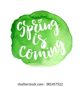Handwritten lettering "Spring is coming". Brush Pen modern calligraphy with hand drawn watercolor texture
