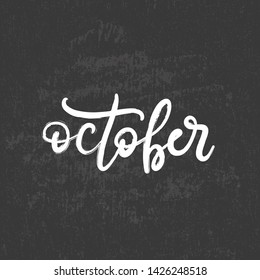 Handwritten name of month october on black chalkboard for bullet journal, calendar, organizer, poster design, greeting card. Hand lettering vector illustration EPS10 in calligraphic style