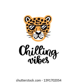 Handwritten phrase: Chilling vibes. Leopard with glasses smiling. It can be used for card, brochures, poster, flyer, t-shirt, promotional materials.