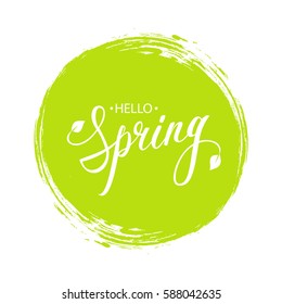 Handwritten Phrase Hello Spring With Leaves And Green Circle Brush Stroke Background. Vector Illustration.