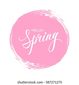 Handwritten phrase Hello Spring with pink circle brush stroke background. Vector illustration.