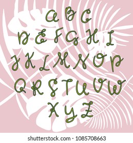 Handwritten Script font with stylish and trendy palm leaves. Hand drawn alphabet with the theme of the tropics. Hand lettering alphabet design, handwritten modern calligraphy cursive font. 