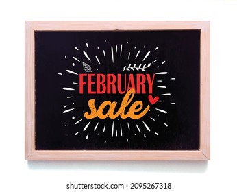 Handwritten text  february sale  black chalkboard againt white outdoor wall