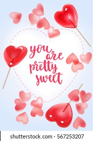 Handwritten vintage lettering romantic quote. Vector illustration on blue background with decorative sweet candy hearts and red lollipops for greeting card Valentine's day, wedding, poster or leaflet.