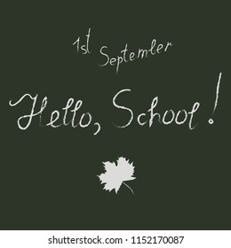 Handwritten white inscription "Hello School", "first of September" and autumn leaf on a black background