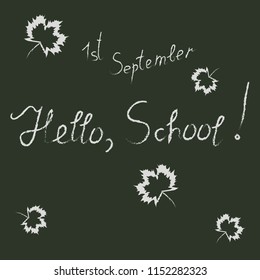 Handwritten white inscription "Hello School", "first of September" and autumn leaves on a black background