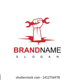 Handy Man Logo With hand holding a wrench in Cracked Earth Symbol 