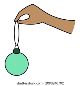 Hang a Christmas tree toy on a Christmas tree. Spaniard hand and green glass ball. Colored vector illustration. The Christmas ball hangs on a thread. Isolated background. Decorate the Christmas tree. 