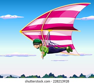 Hang glider flying in sky