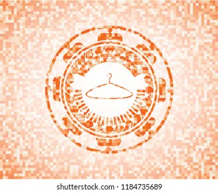 hanger icon inside abstract emblem, orange mosaic background