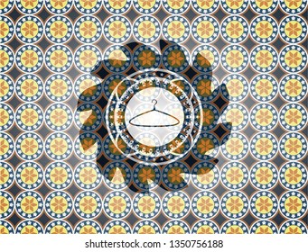 hanger icon inside arabesque badge background. arabic decoration.