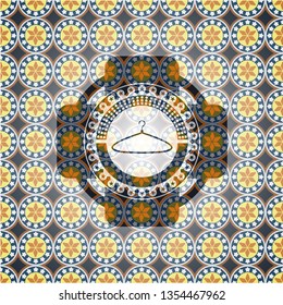 hanger icon inside arabesque badge background. arabic decoration.