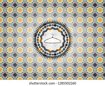hanger icon inside arabesque style badge. arabic decoration.