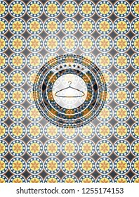 hanger icon inside arabic badge. Arabesque decoration.