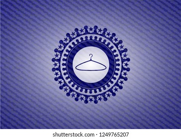 hanger icon inside badge with denim texture
