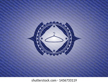 hanger icon inside badge with denim texture