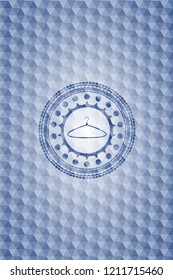 hanger icon inside blue emblem or badge with abstract geometric pattern background.