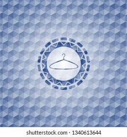 hanger icon inside blue emblem or badge with geometric pattern background.