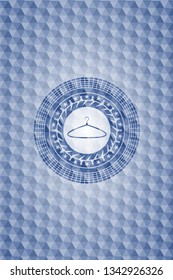 hanger icon inside blue hexagon emblem.