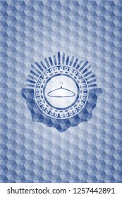 hanger icon inside blue polygonal emblem.