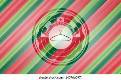 hanger icon inside christmas emblem.