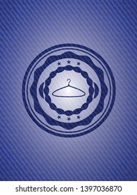 hanger icon inside emblem with jean background