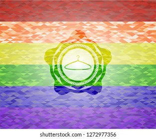 hanger icon inside emblem on mosaic background with the colors of the LGBT flag