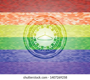 hanger icon inside emblem on mosaic background with the colors of the LGBT flag