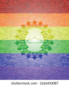 hanger icon inside emblem on mosaic background with the colors of the LGBT flag
