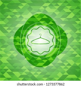 hanger icon inside green mosaic emblem