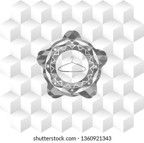 hanger icon inside grey badge with geometric cube white background