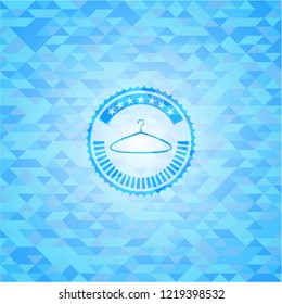 hanger icon inside light blue emblem with mosaic background