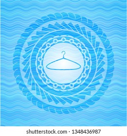 hanger icon inside light blue water wave badge.
