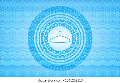 hanger icon inside light blue water style emblem.