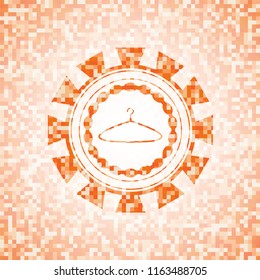 hanger icon inside orange mosaic emblem with background