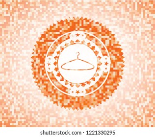 hanger icon inside orange mosaic emblem